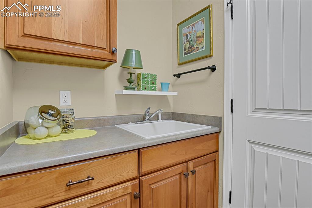 13015 Cake Bread Heights Colorado Springs, CO 80921 - Photo 25 of 45 a bathroom with a sink and a mirror