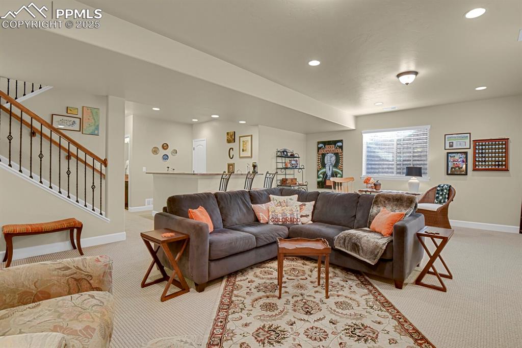 13015 Cake Bread Heights Colorado Springs, CO 80921 - Photo 30 of 45 a living room with furniture and a wooden floor