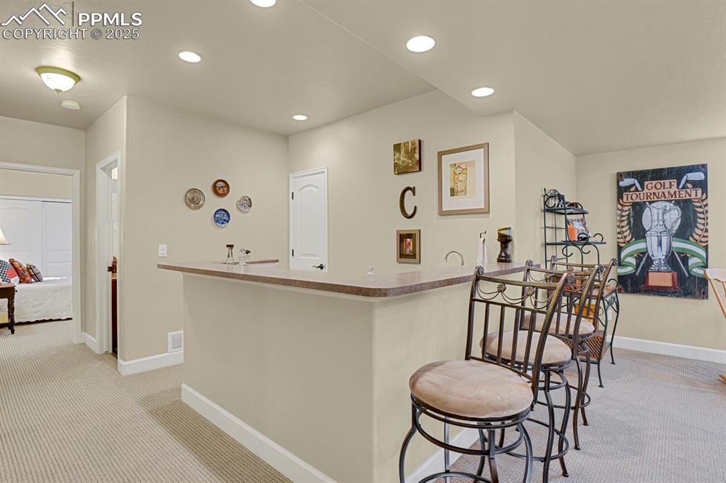 13015 Cake Bread Heights Colorado Springs, CO 80921 - Photo 31 of 45 a view of a room with furniture and wooden floor