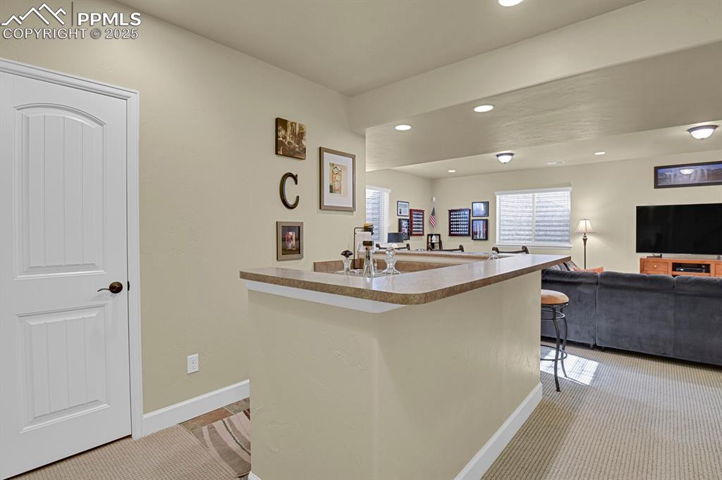 13015 Cake Bread Heights Colorado Springs, CO 80921 - Photo 32 of 45 a kitchen with stainless steel appliances granite countertop a sink and a refrigerator