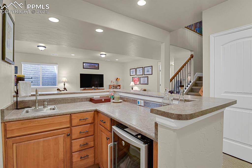13015 Cake Bread Heights Colorado Springs, CO 80921 - Photo 33 of 45 a kitchen with a sink stove and cabinets