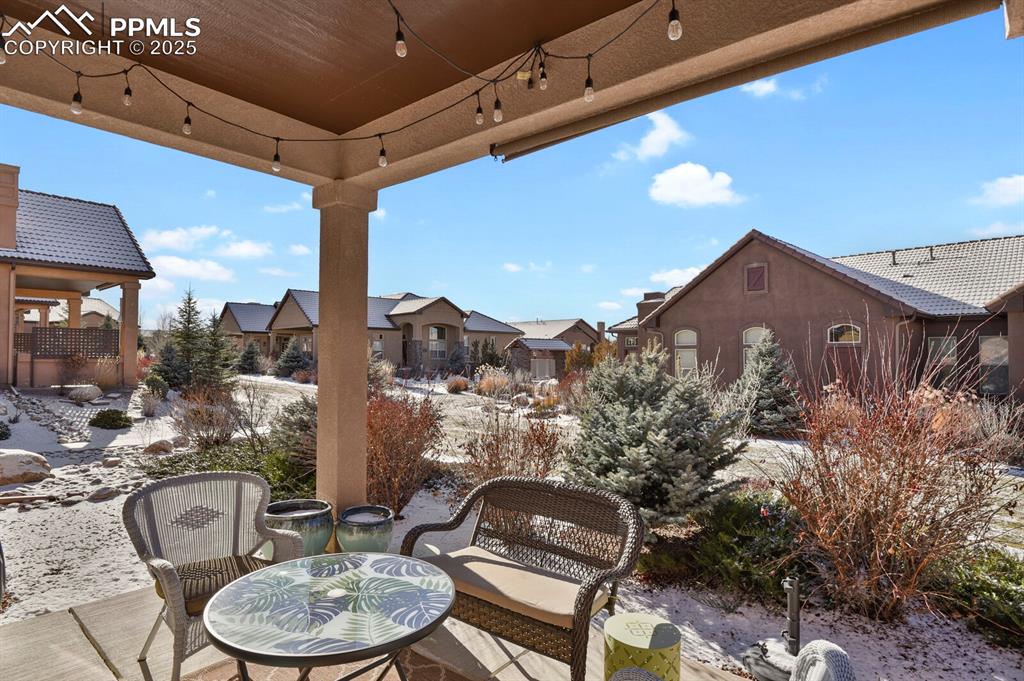 13015 Cake Bread Heights Colorado Springs, CO 80921 - Photo 40 of 45 a view of a chairs and table in the patio