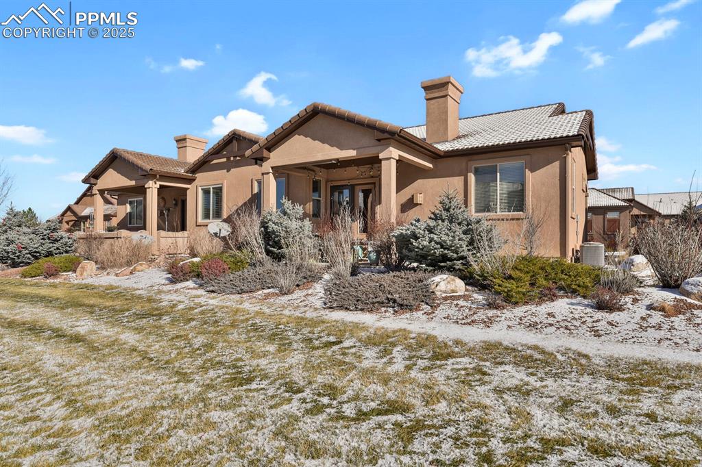 13015 Cake Bread Heights Colorado Springs, CO 80921 - Photo 42 of 45 a front view of a house with garden
