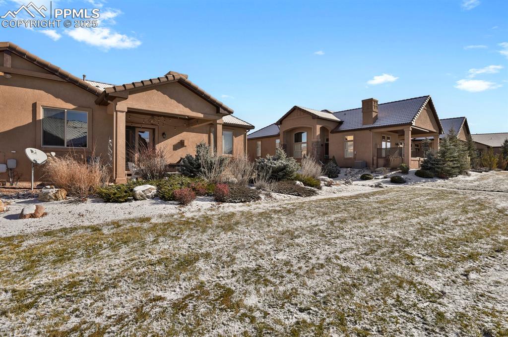 13015 Cake Bread Heights Colorado Springs, CO 80921 - Photo 45 of 45 a front view of a house with a yard