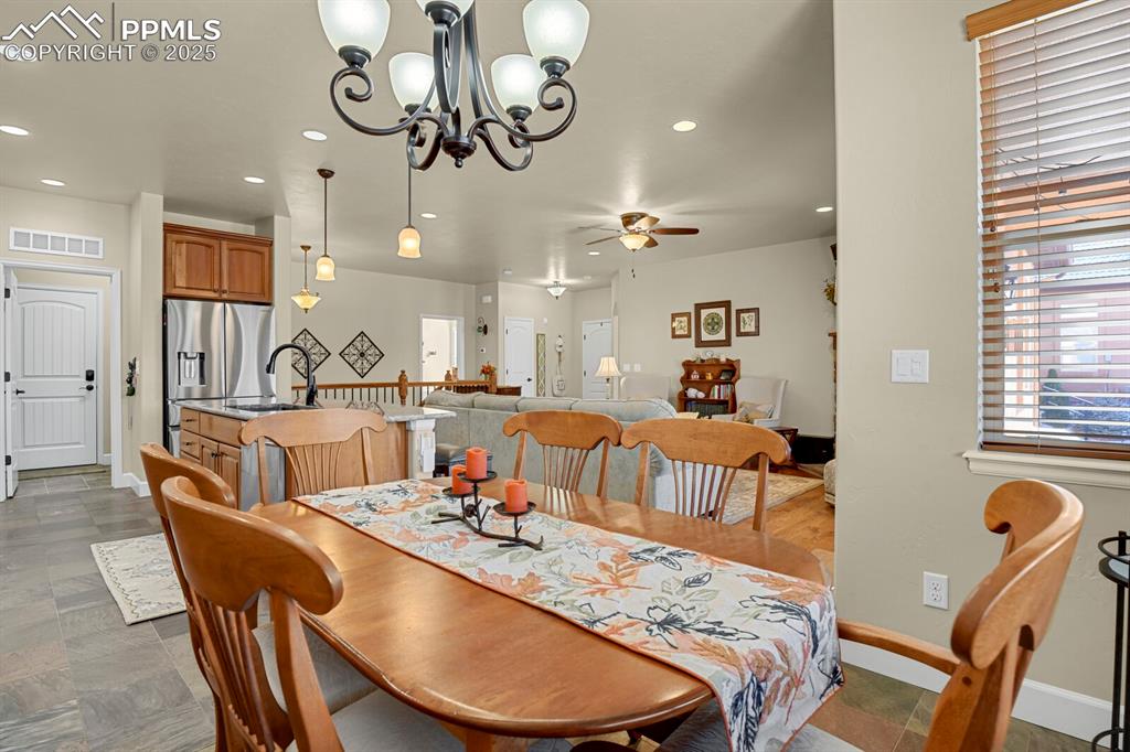 13015 Cake Bread Heights Colorado Springs, CO 80921 - Photo 9 of 45 a view of a dining room with furniture