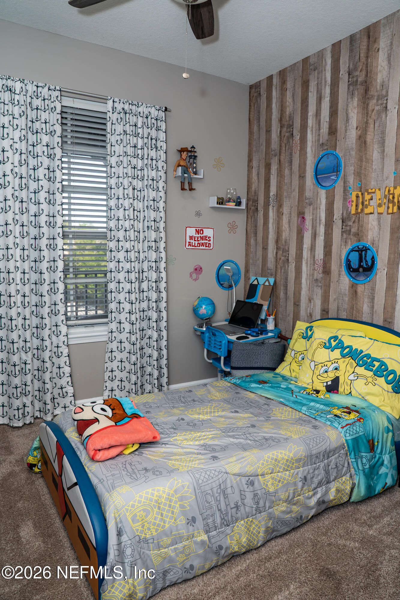 7990 Baymeadows Road East, Unit 530 Jacksonville, FL 32256 - Photo 16 of 19 a bedroom with a bed and a dresser in it
