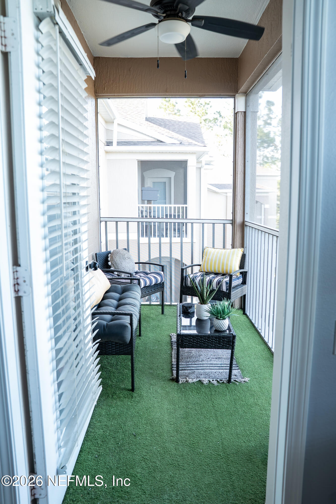 7990 Baymeadows Road East, Unit 530 Jacksonville, FL 32256 - Photo 18 of 19 a living room with furniture and a yard