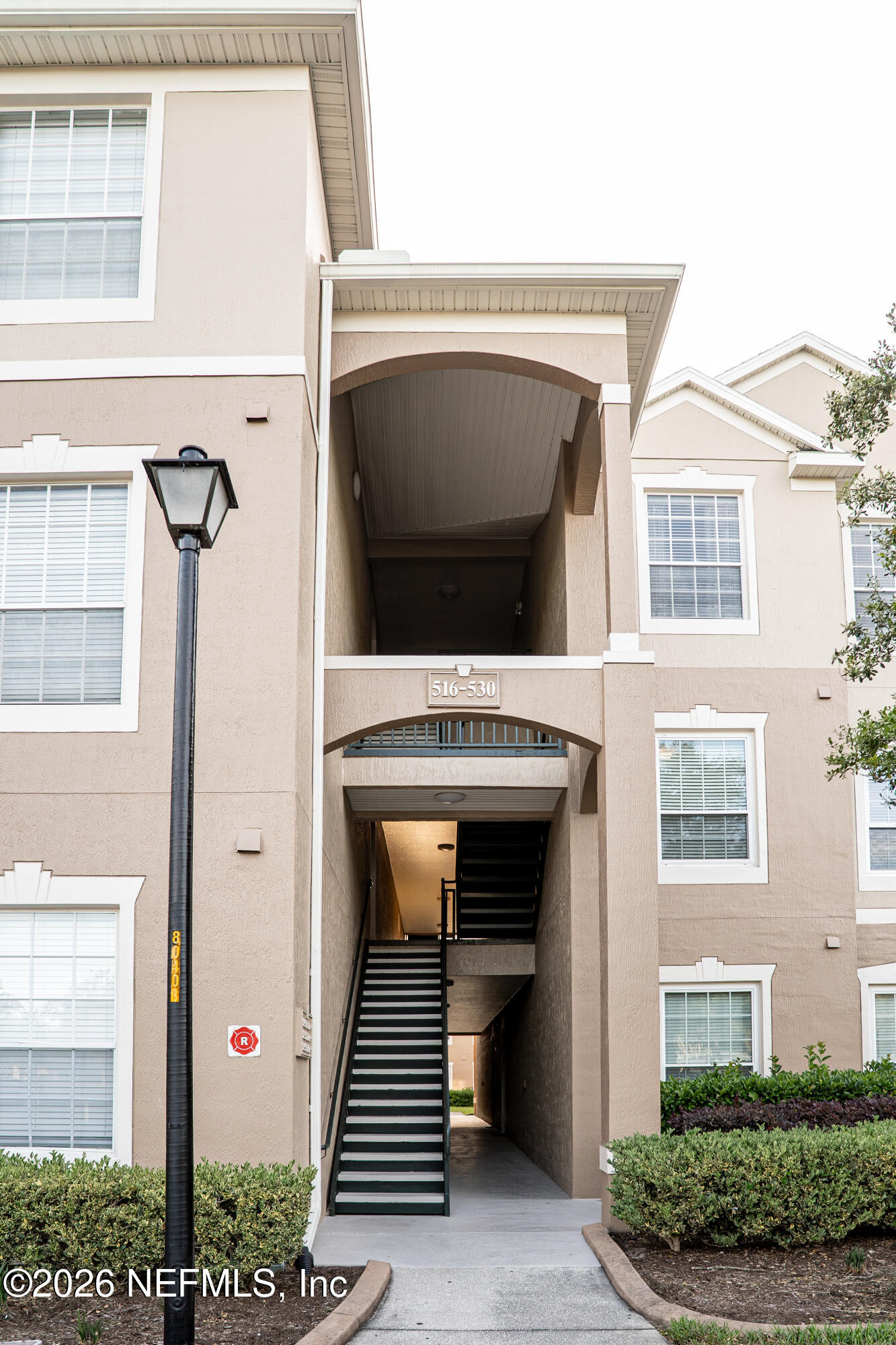 7990 Baymeadows Road East, Unit 530 Jacksonville, FL 32256 - Photo 19 of 19 a front view of a house with stairs