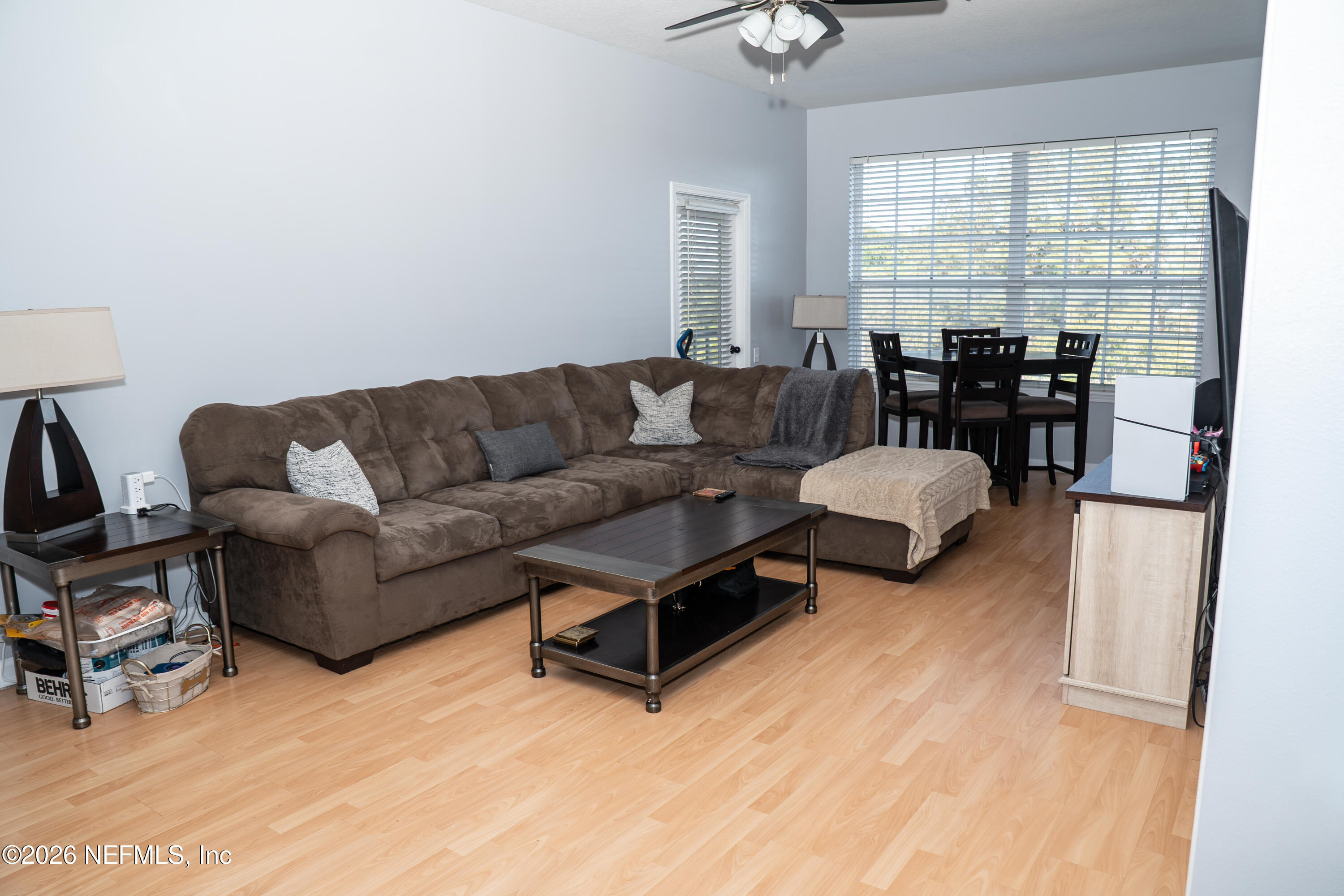 7990 Baymeadows Road East, Unit 530 Jacksonville, FL 32256 - Photo 2 of 19 a living room with furniture and a large window