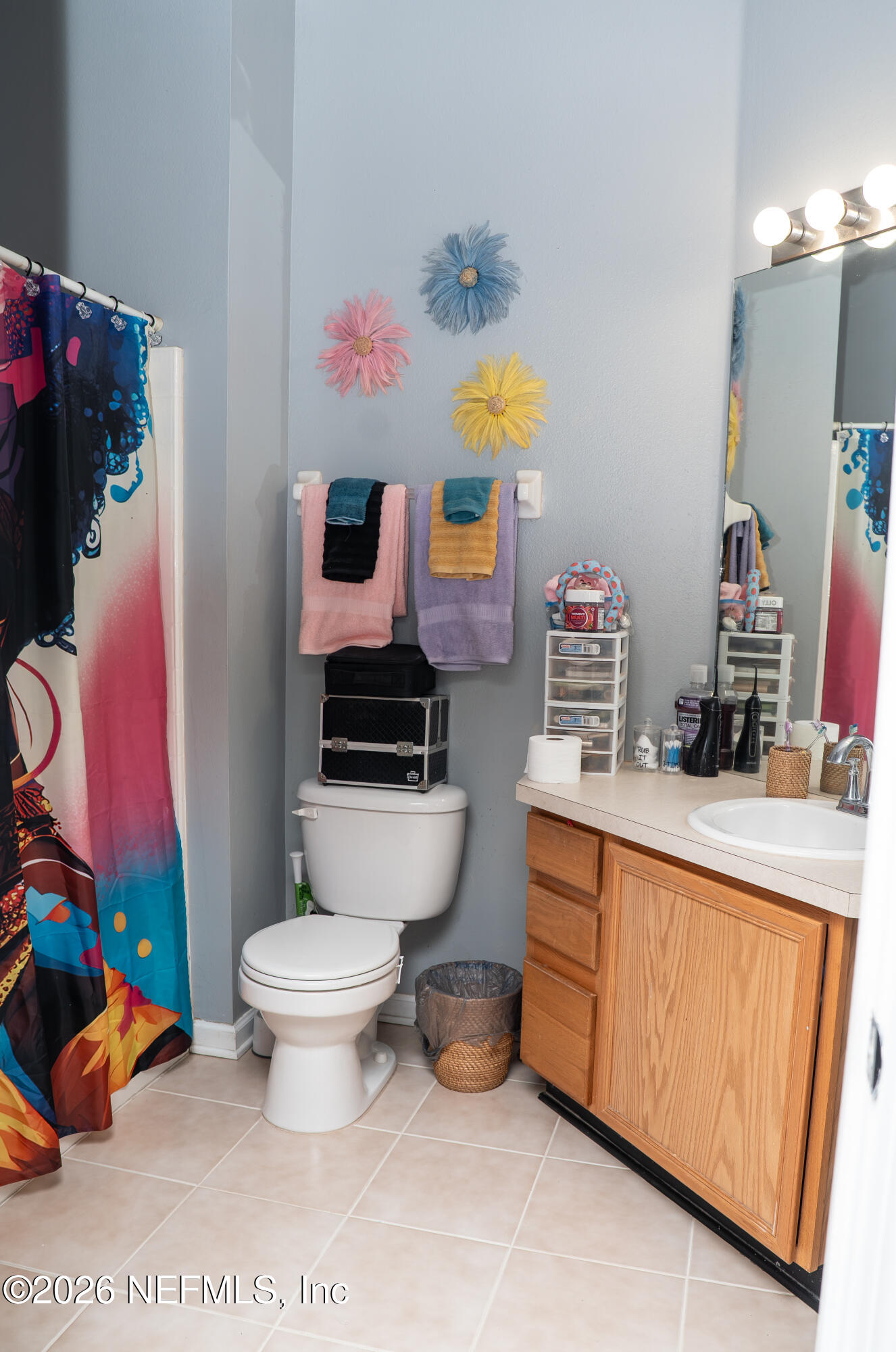 7990 Baymeadows Road East, Unit 530 Jacksonville, FL 32256 - Photo 10 of 19 a bathroom with a sink toilet and mirror