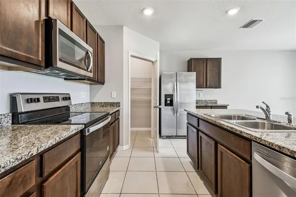 a kitchen with sink and window