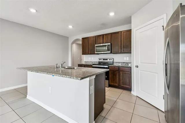 a view of an empty room and wooden floor