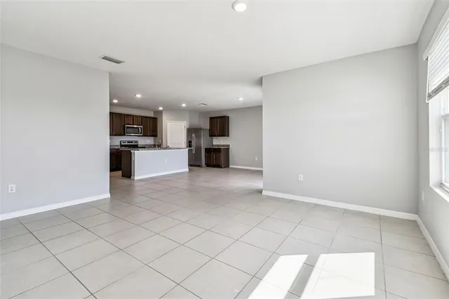 a bathroom with a double vanity sink mirror and bathtub