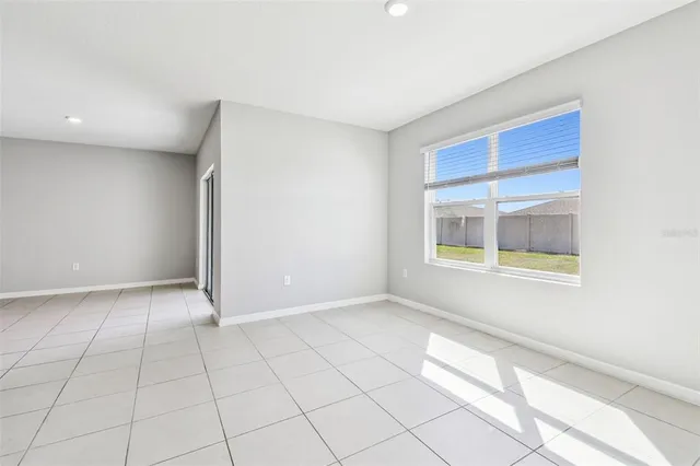 a bathroom with a granite countertop sink a mirror and shower