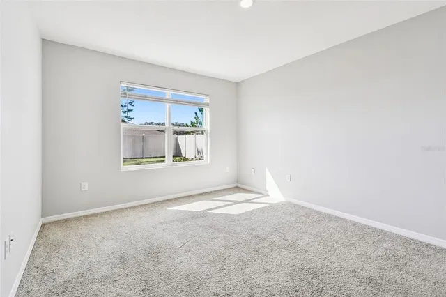 a bathroom with a granite countertop double vanity sink and a mirror