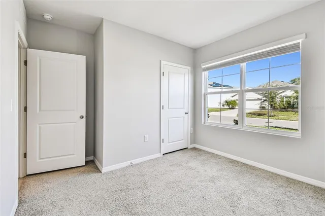 a bathroom with a sink toilet vanity and shower