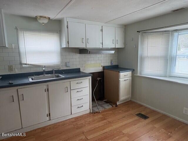 16 Aztec Drive North Adams, MA 01247 - Photo 3 of 13 a kitchen with granite countertop white cabinets and white appliances