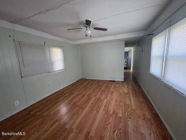 16 Aztec Drive North Adams, MA 01247 - Photo 5 of 13 a view of empty room with wooden floor and fan