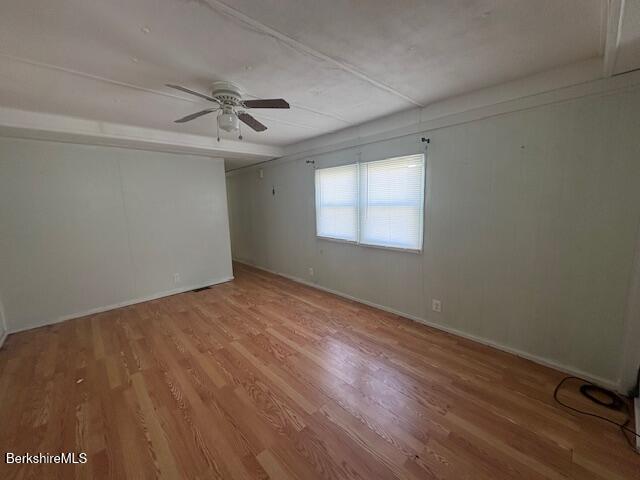 16 Aztec Drive North Adams, MA 01247 - Photo 6 of 13 an empty room with wooden floor ceiling fan and windows