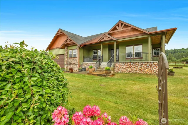 a front view of yellow house with swimming pool