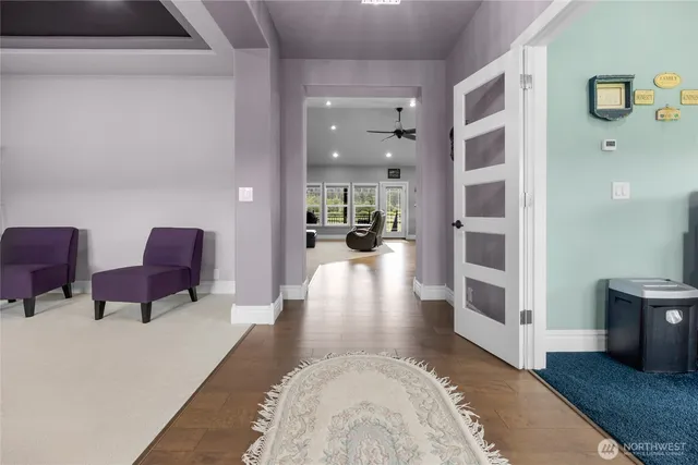 a view of living room with furniture and wooden floor