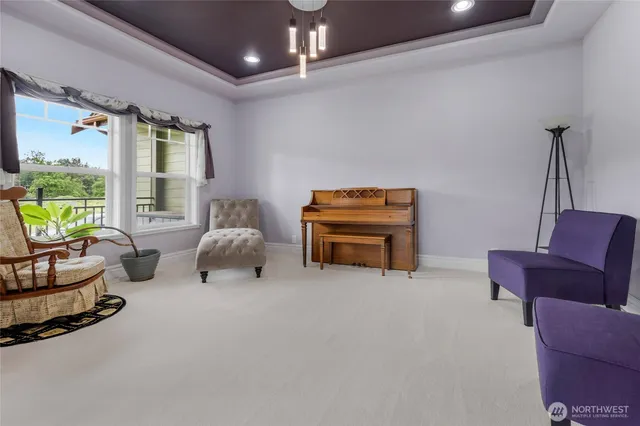 a living room with furniture gym equipment and a large window