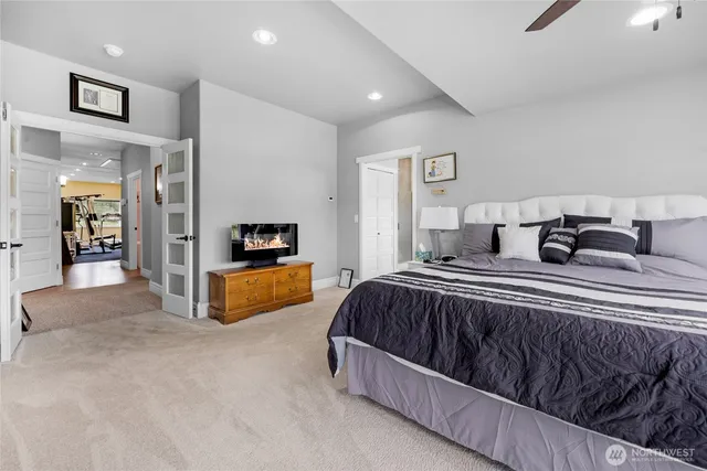 a bedroom with bed and a couch