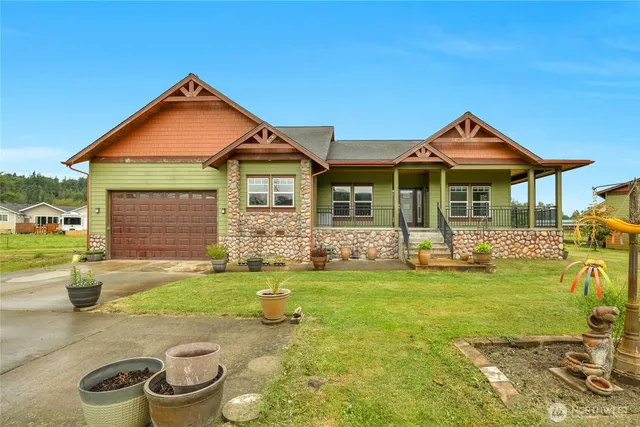a front view of a house with a yard patio and fire pit