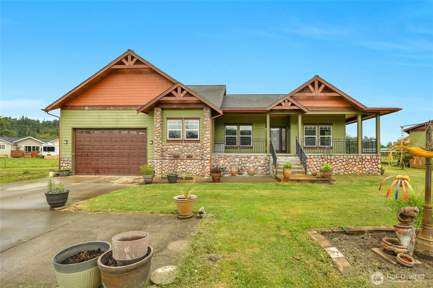 26812 162nd Street Southeast Monroe, WA 98272 - Photo 33 of 40 a front view of a house with a yard patio and fire pit