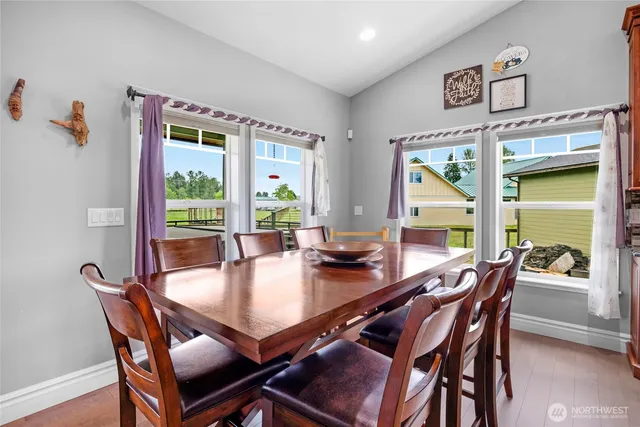 a dining room with furniture and window