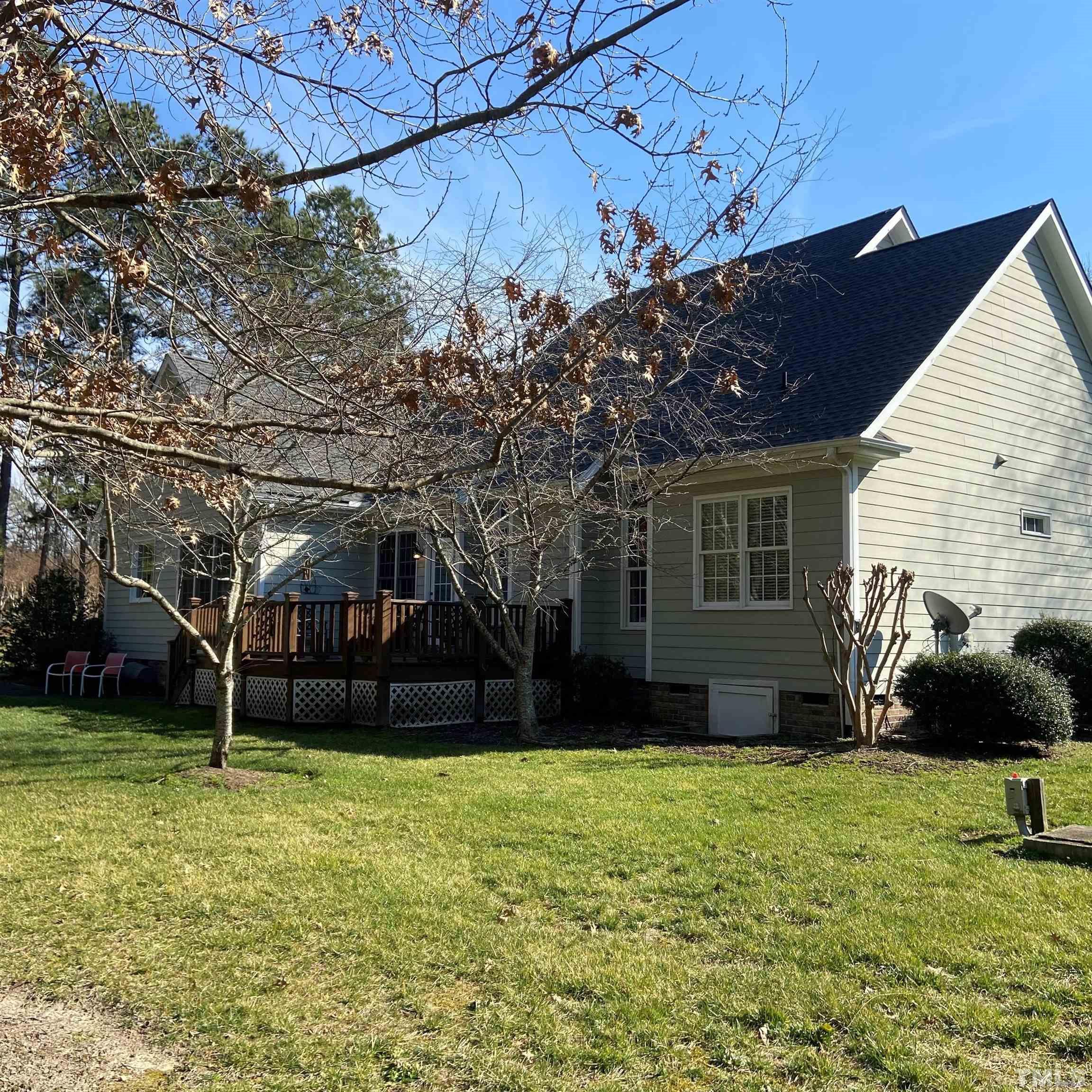 65 Oak Grove Church Road Youngsville, NC 27596 - Photo 4 of 9 a view of a house with a yard