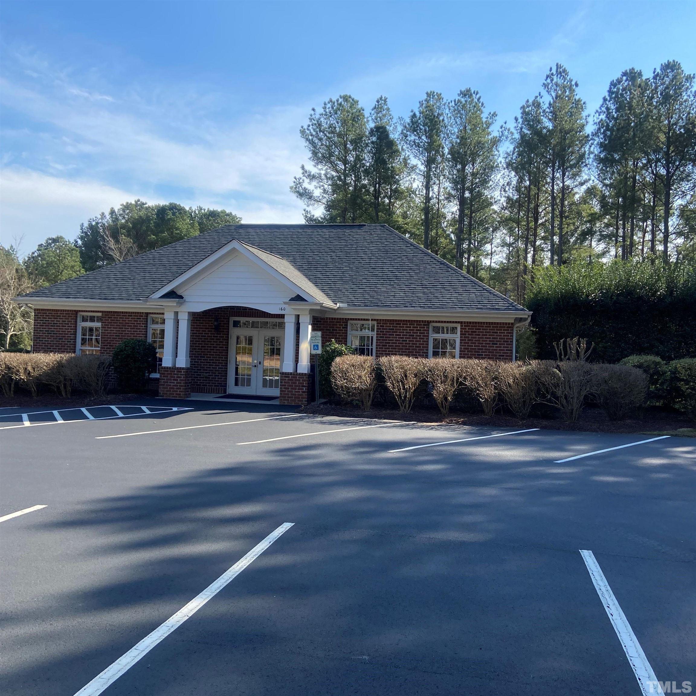 65 Oak Grove Church Road Youngsville, NC 27596 - Photo 8 of 9 a front view of a house with a garden