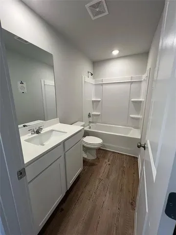 a bathroom with a sink and toilet