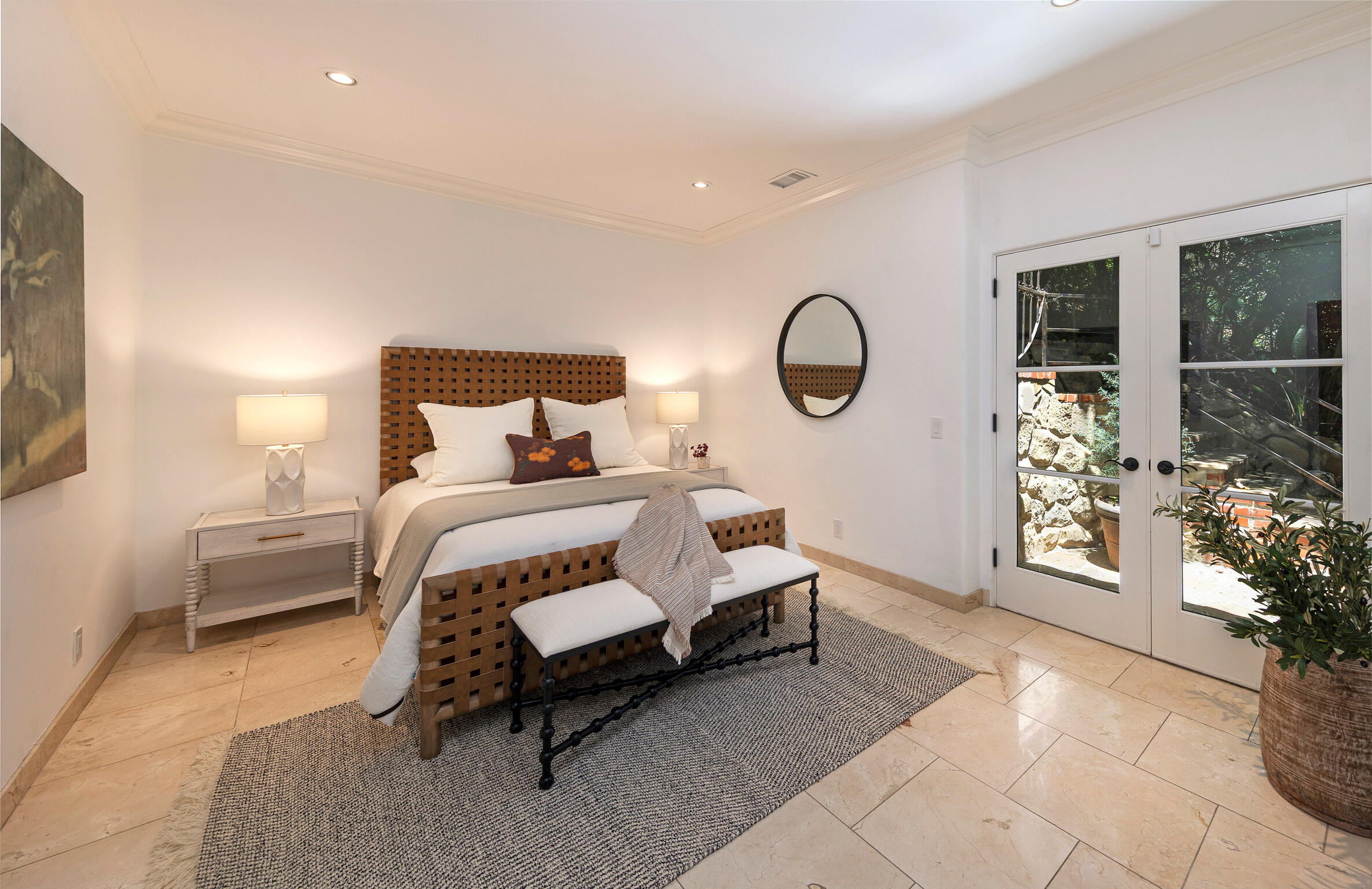 1493 Sycamore Canyon Road Montecito, CA 93108 - Photo 19 of 47 a spacious bedroom with a bed a mirror and a large window