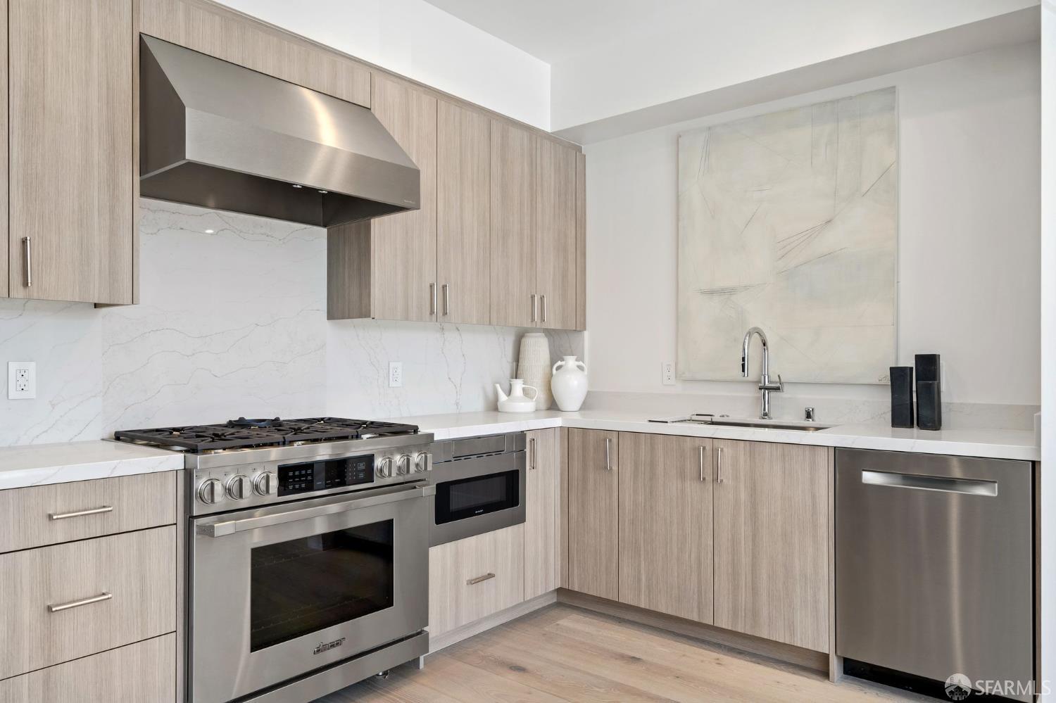 425 1st Street, Unit 31 Los Altos, CA 94022 - Photo 7 of 19 a kitchen with cabinets and white appliances