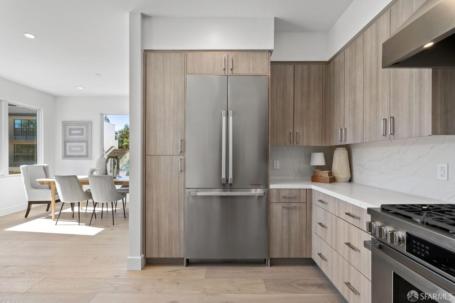 425 1st Street, Unit 31 Los Altos, CA 94022 - Photo 8 of 19 a kitchen with stainless steel appliances granite countertop a refrigerator and a stove top oven