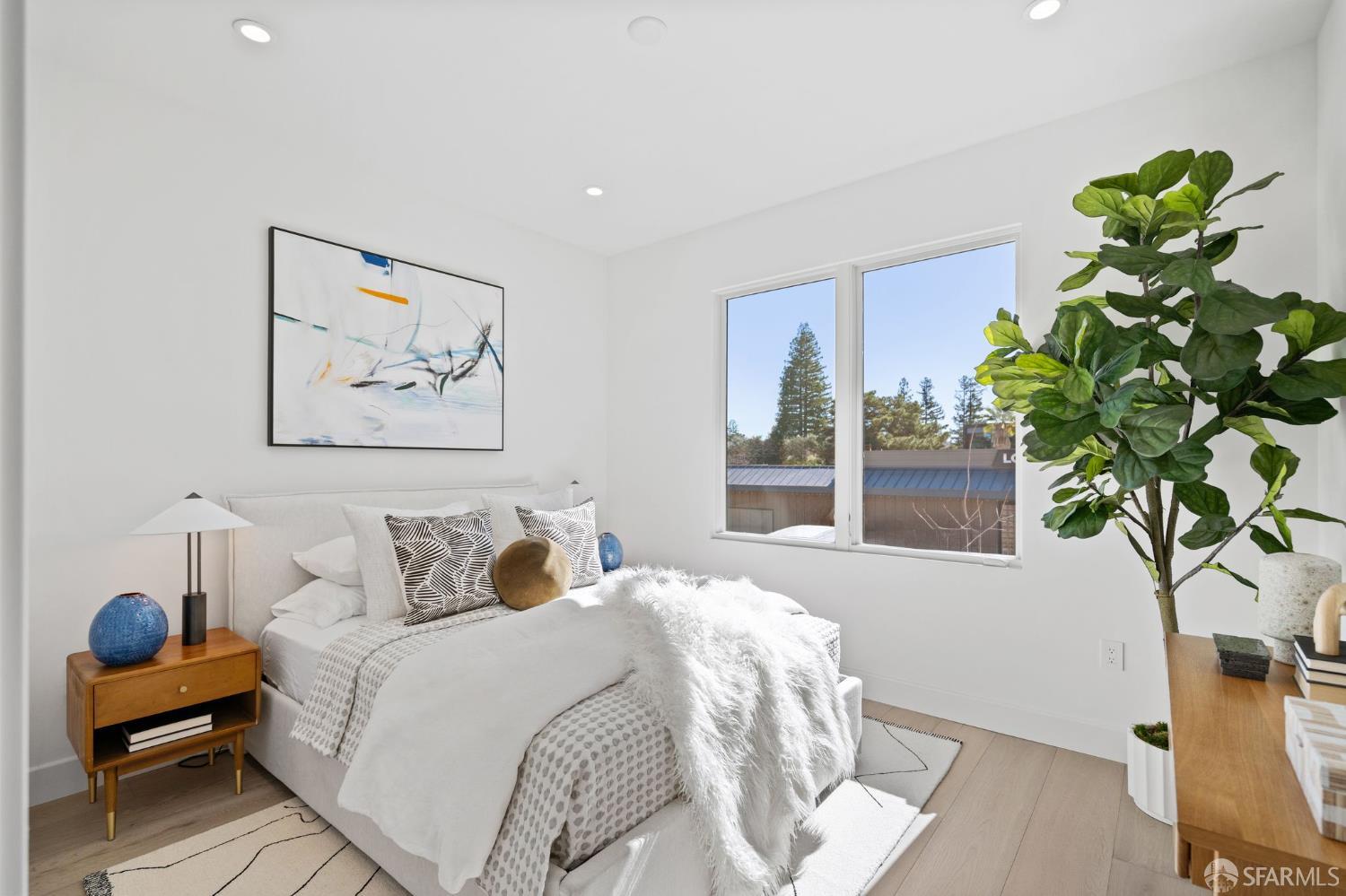 425 1st Street, Unit 31 Los Altos, CA 94022 - Photo 10 of 19 a bedroom with a bed potted plant and a window