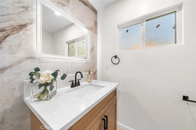 a bathroom with a sink and a mirror