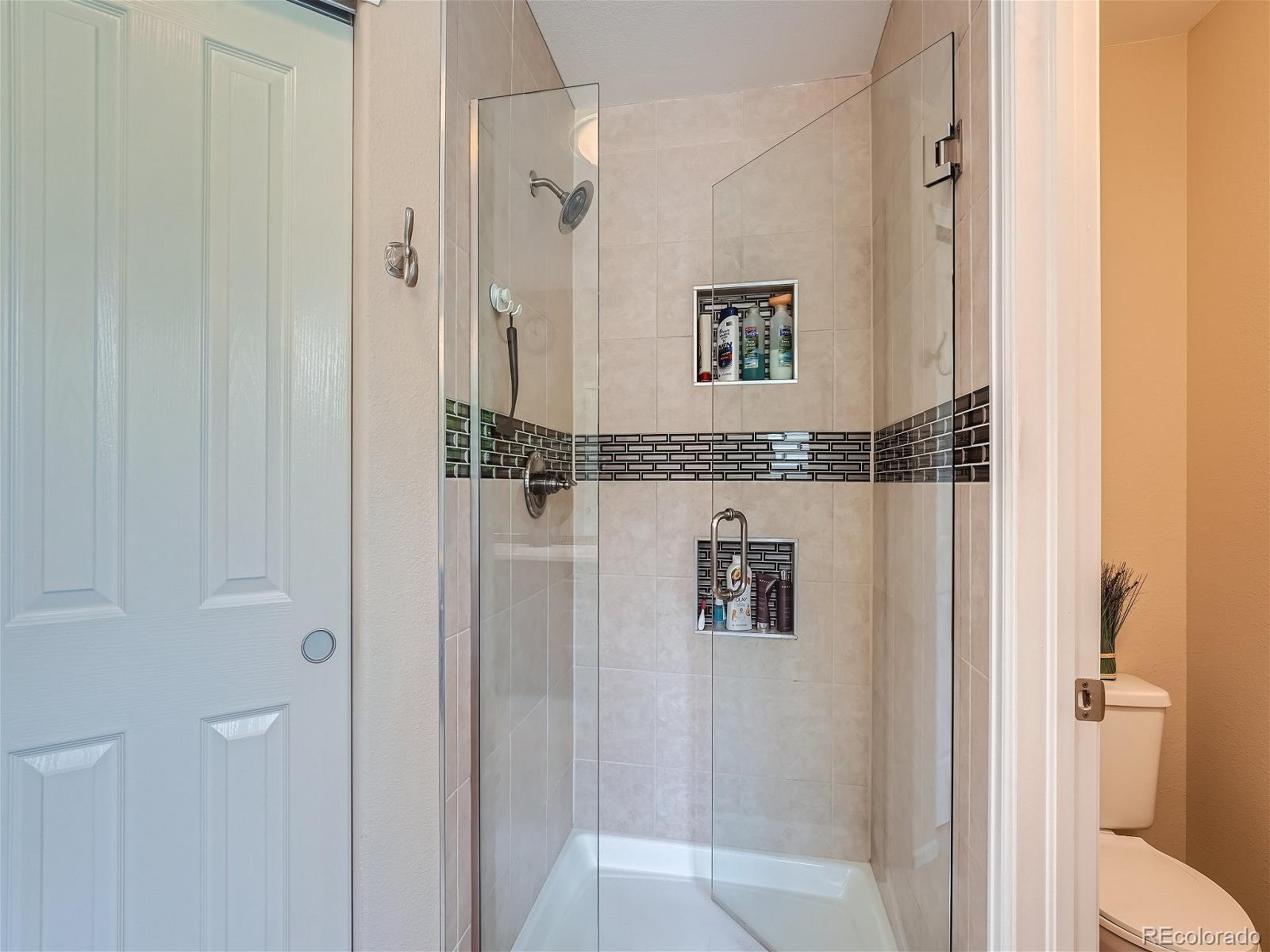 9722 Kipling Street Westminster, CO 80021 - Photo 24 of 37 a bathroom with a shower