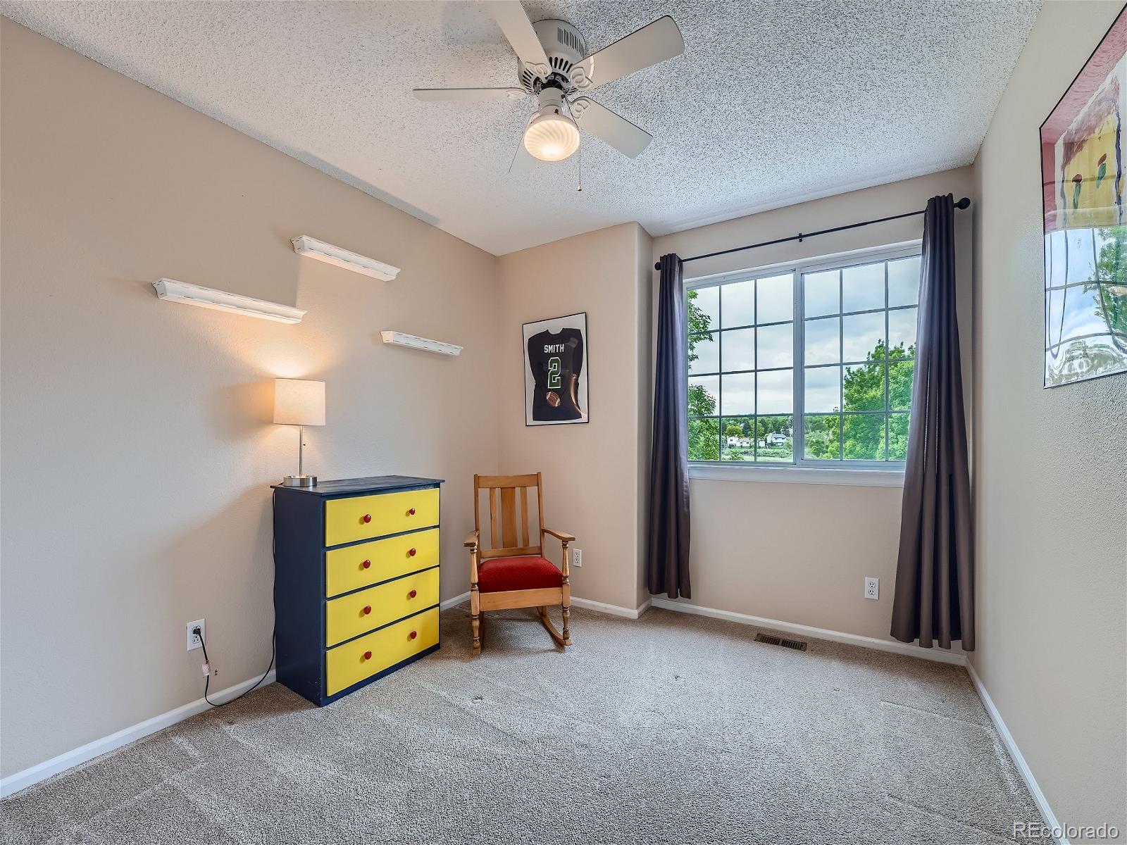 9722 Kipling Street Westminster, CO 80021 - Photo 25 of 37 a view of room with furniture and a window