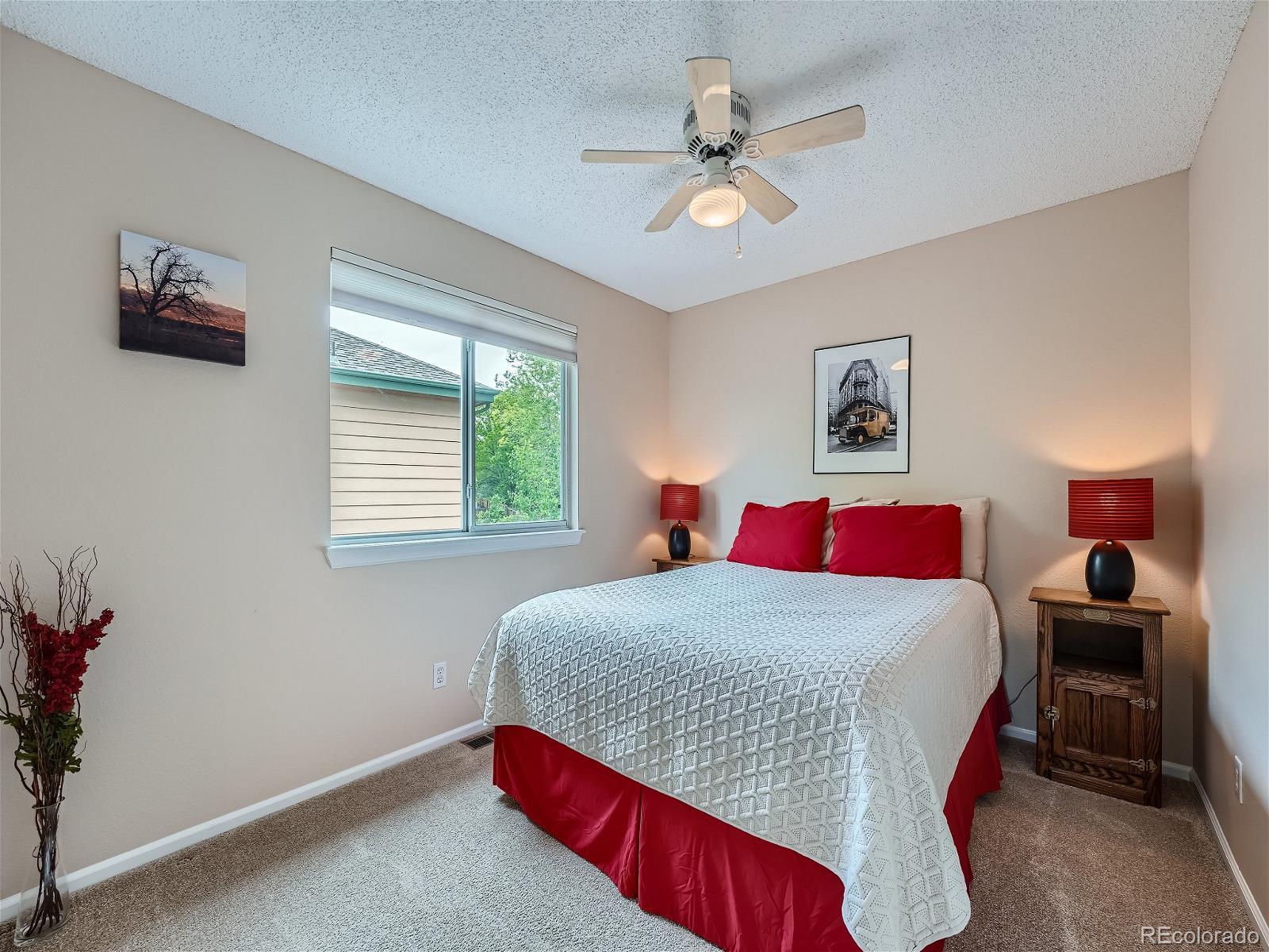 9722 Kipling Street Westminster, CO 80021 - Photo 27 of 37 a bedroom with a large bed and a window