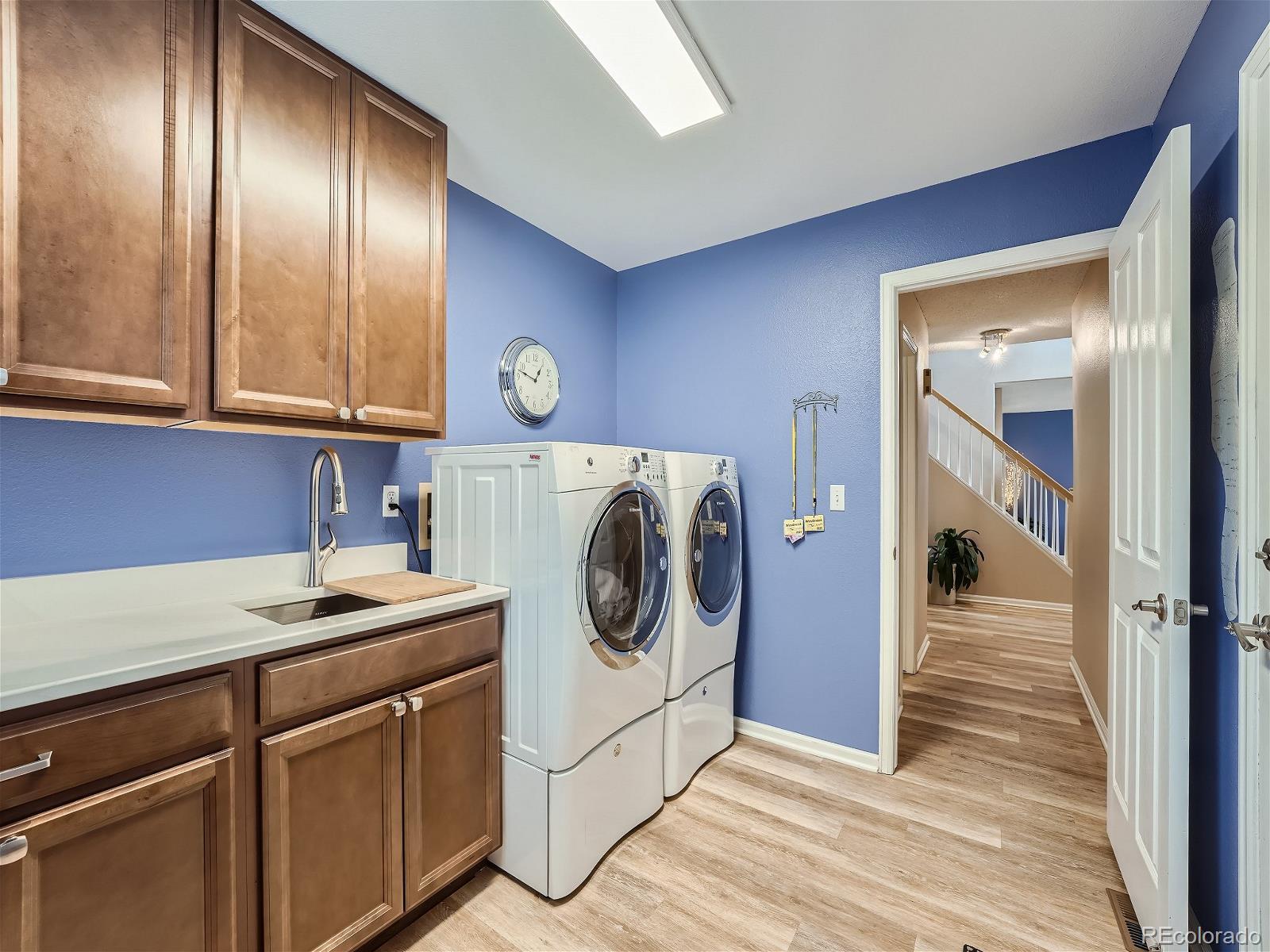 9722 Kipling Street Westminster, CO 80021 - Photo 29 of 37 a utility room with sink dryer and washer