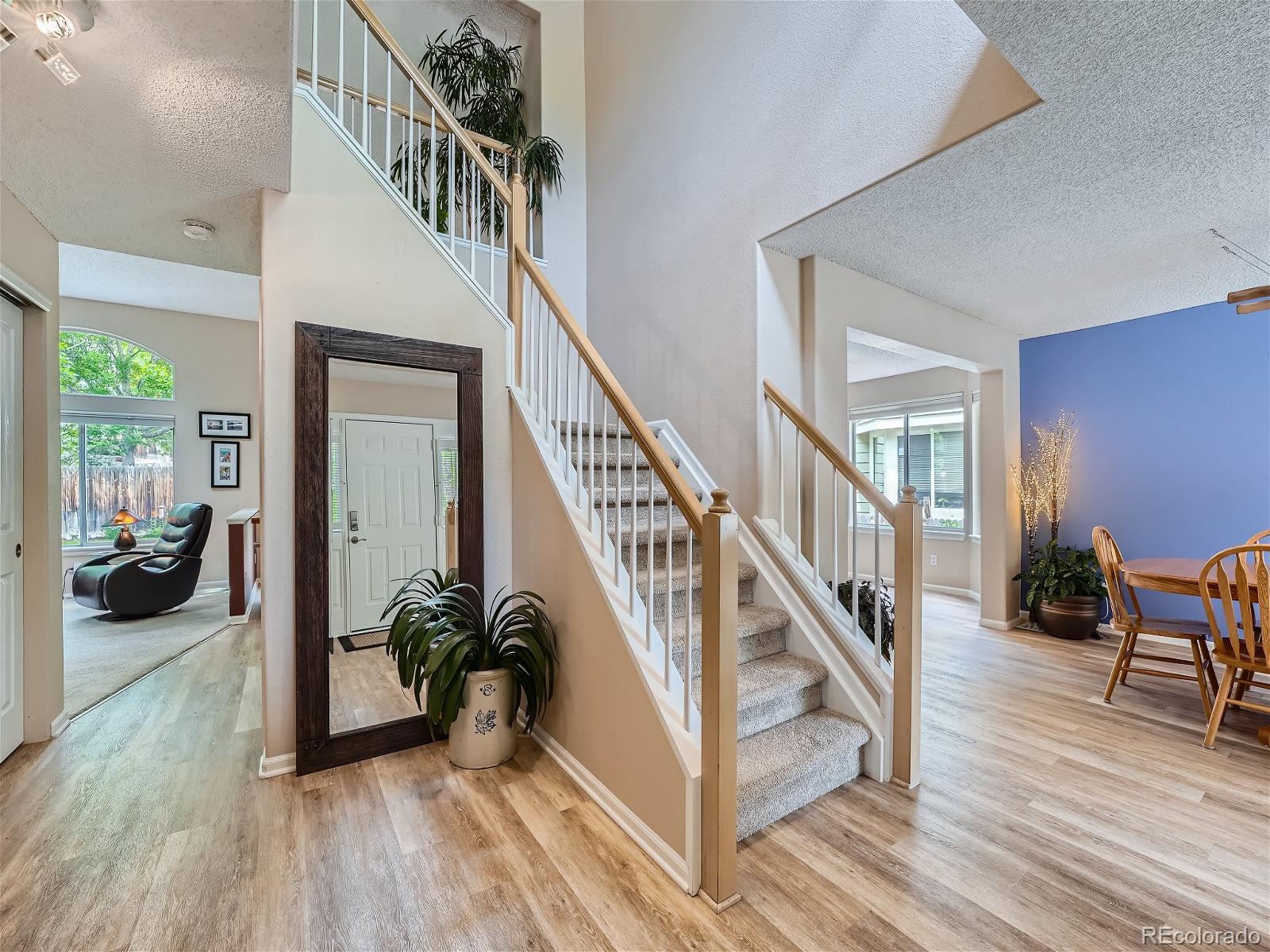 9722 Kipling Street Westminster, CO 80021 - Photo 4 of 37 a view of entryway and hall with wooden floor