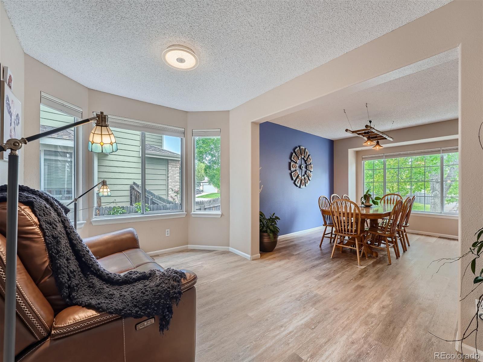 9722 Kipling Street Westminster, CO 80021 - Photo 5 of 37 a dining room with furniture and window