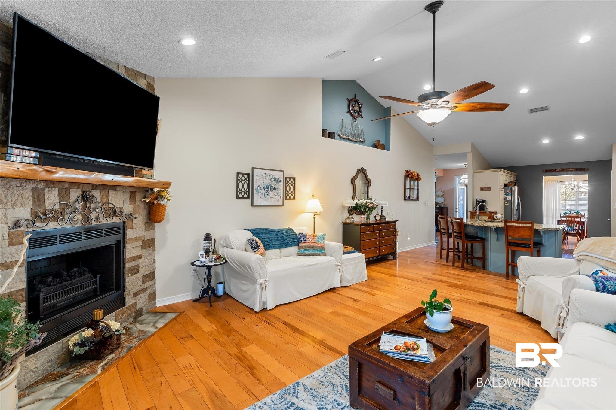 356 Collinwood Loop Foley, AL 36535 - Photo 15 of 21 Living room featuring ceiling fan, light wood-type flooring, a fireplace, and vaulted ceiling
