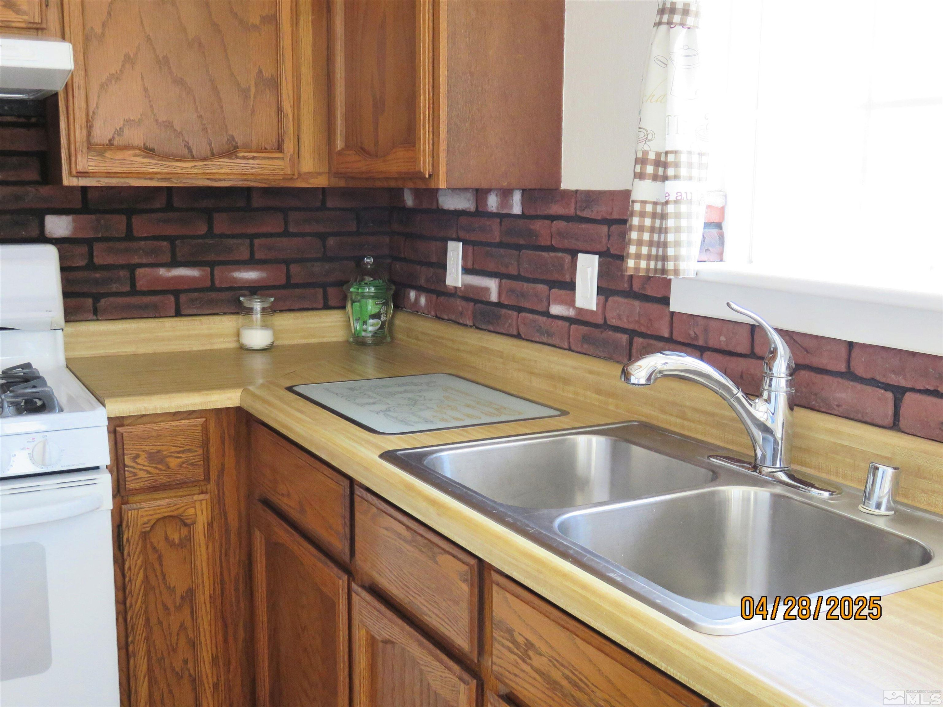 3973 Knoblock Road Carson City, NV 89706 - Photo 11 of 39 a kitchen with a sink and a window