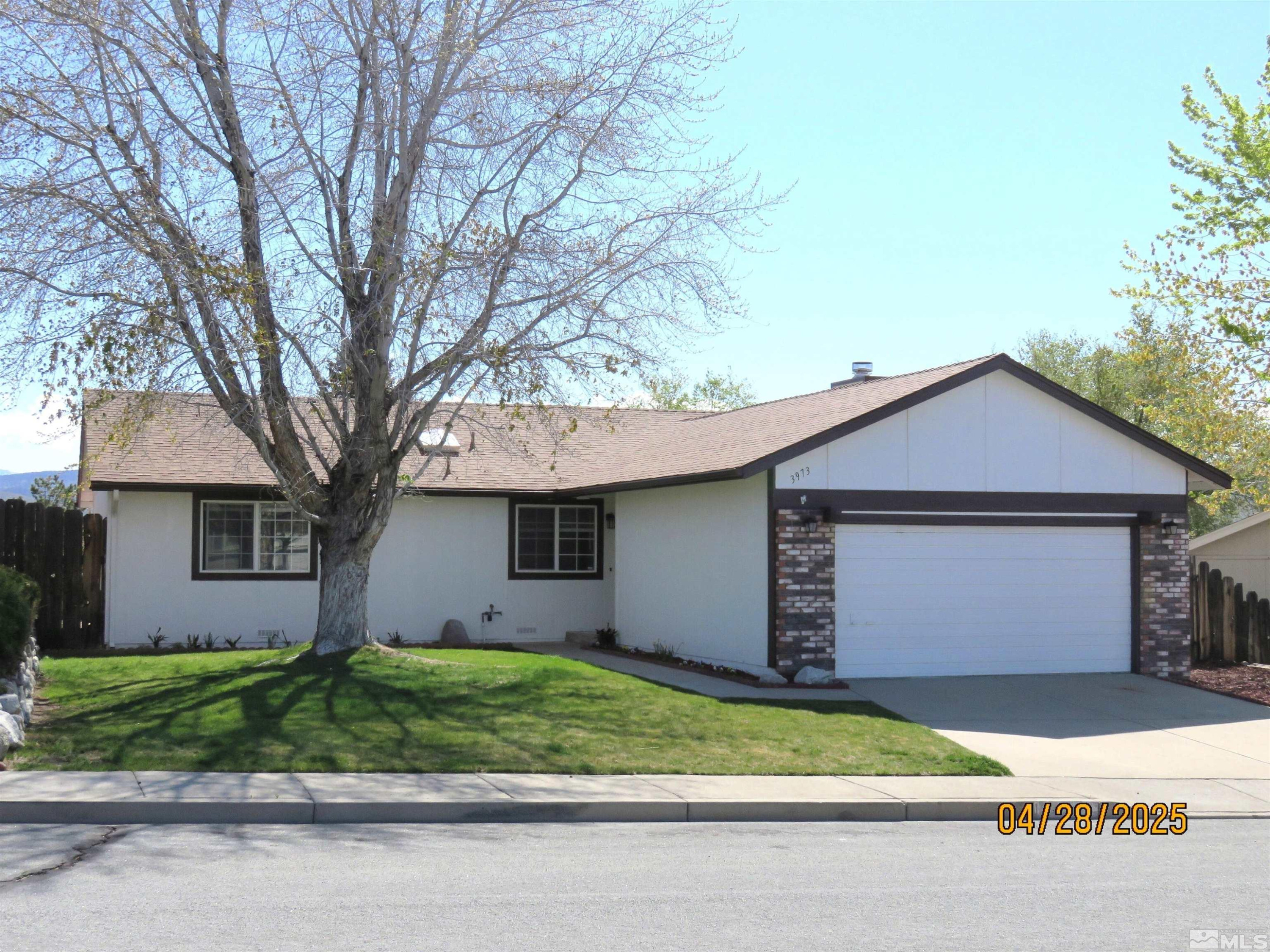 3973 Knoblock Road Carson City, NV 89706 - Photo 2 of 39 a front view of house with a garden