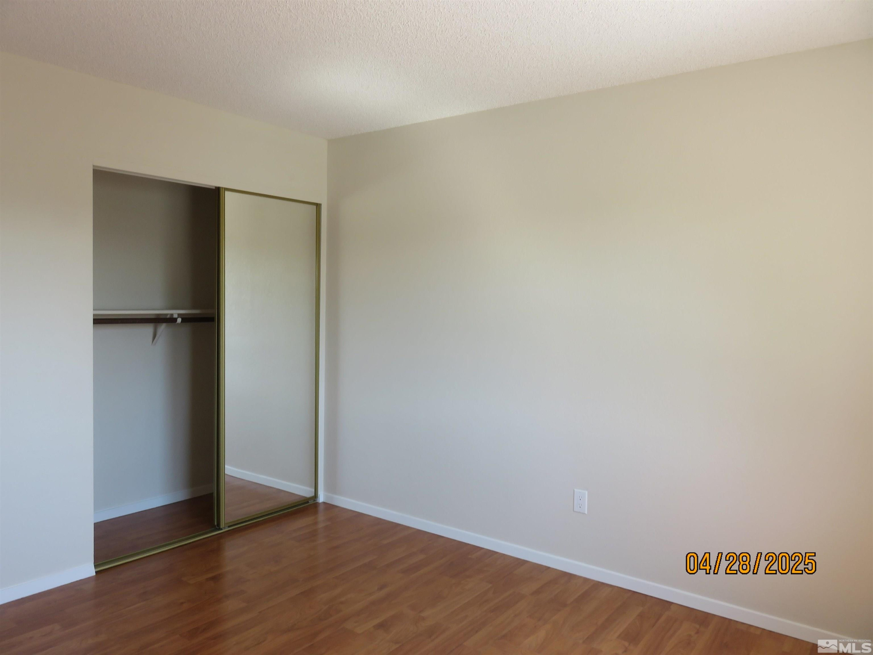 3973 Knoblock Road Carson City, NV 89706 - Photo 25 of 39 a view of an empty room with wooden floor