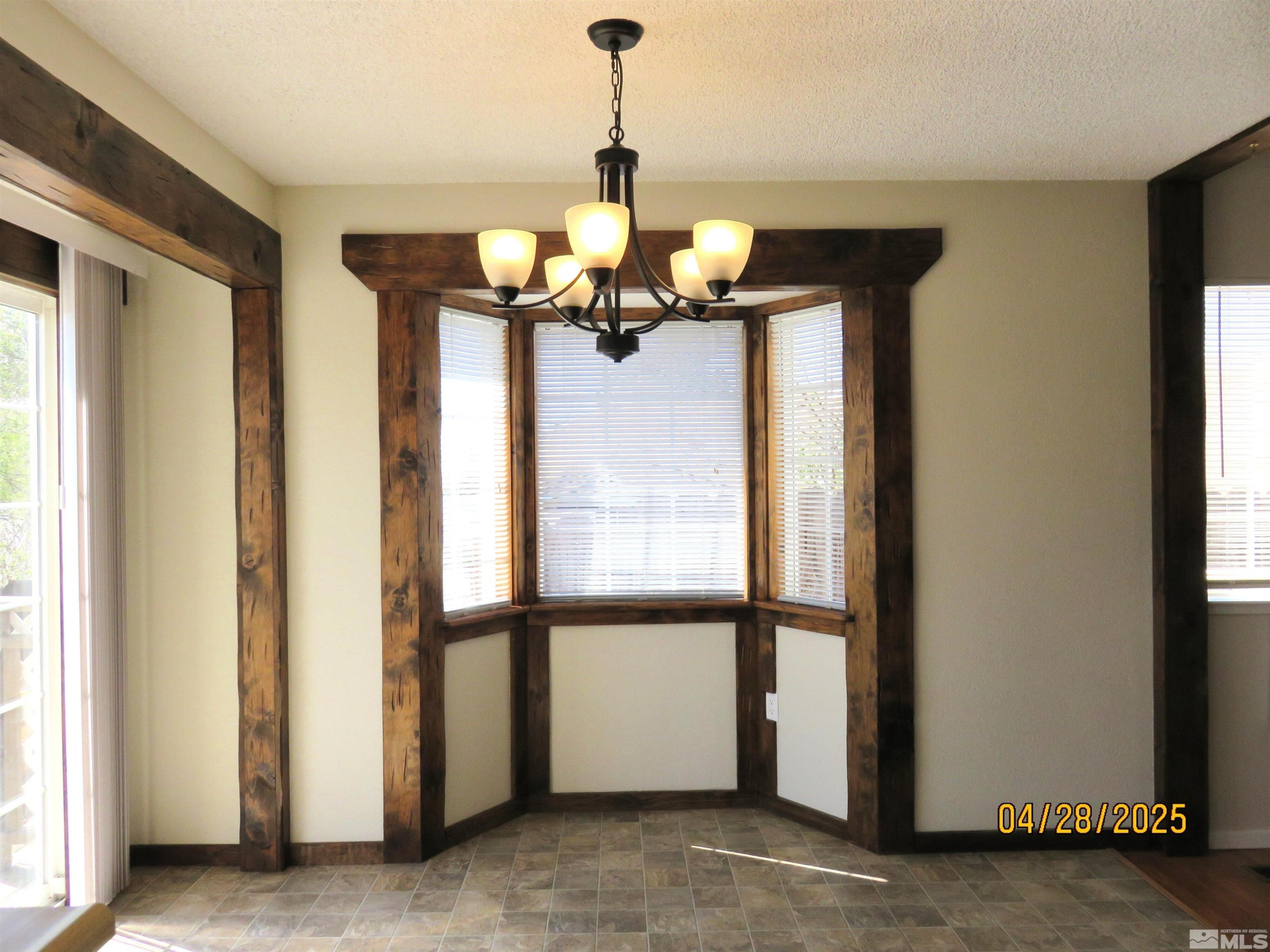 3973 Knoblock Road Carson City, NV 89706 - Photo 9 of 39 a view of a room with furniture and windows