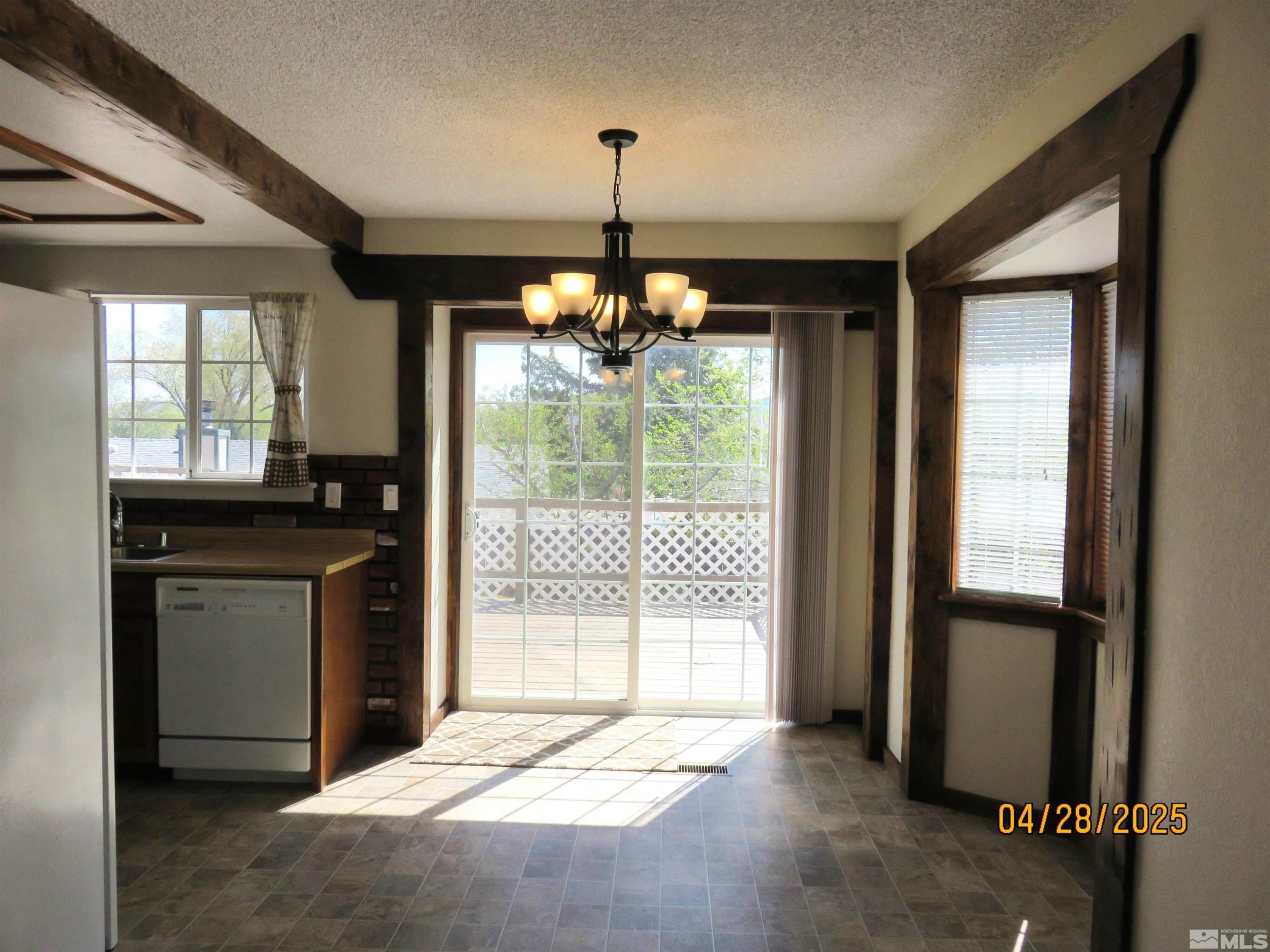 3973 Knoblock Road Carson City, NV 89706 - Photo 10 of 39 a kitchen with refrigerator and window